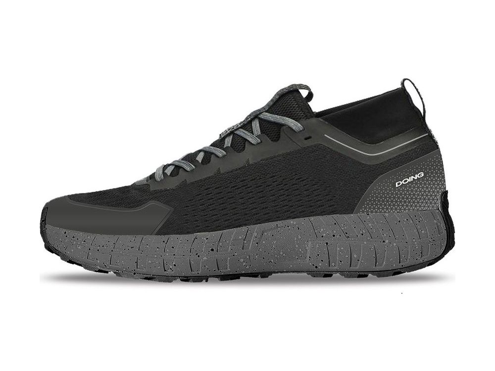 OEM/ODM black mesh low-cut trail shoe with welded TPU overlays, a padded heel pull loop and a grey speckled midsole over a black lugged outsole, manufactured by DOING Footwear