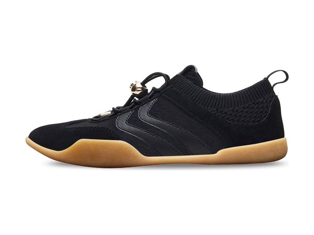 OEM/ODM all-black suede and nylon low-top sneaker with a knitted sock collar, black bungee lace with gold cord lock and aglets, heel pull loop and a gum outsole, manufactured by DOING Footwear