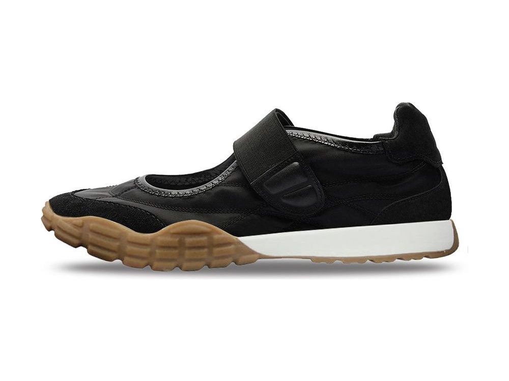 OEM/ODM black nylon and leather sneaker closed by a wide hook-and-loop instep strap, with black suede toe wrap and heel, white midsole and a chunky gum lug outsole, manufactured by DOING Footwear