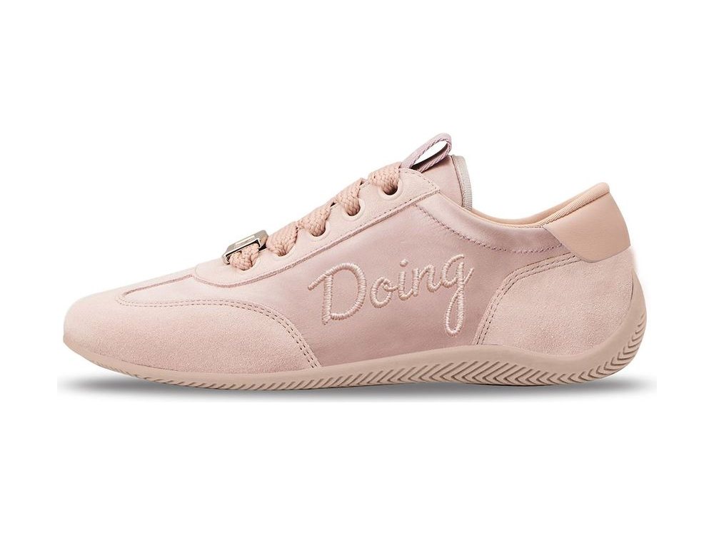 OEM/ODM blush pink suede and satin low trainer with tonal script embroidery on the quarter, thick pink rope laces held by a metal lace keeper and a pink herringbone outsole, manufactured by DOING Footwear